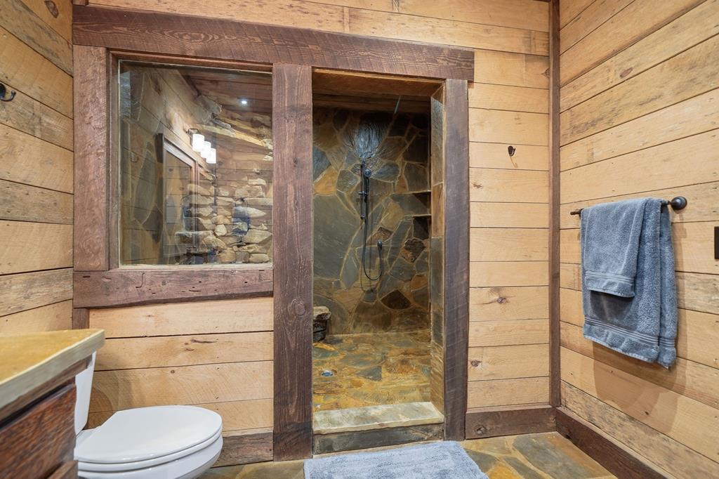 249 Settlement Road Epworth, GA 30541 - Photo 18 of 43 a bathroom with a toilet and a shower