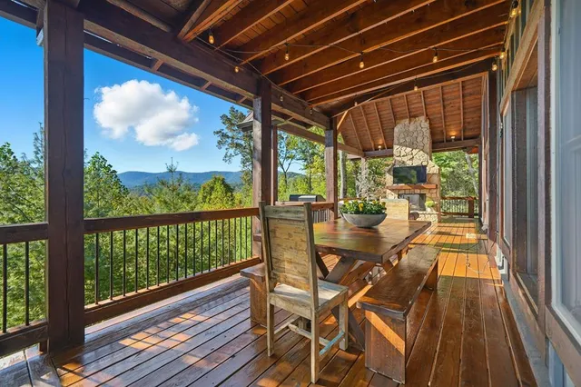 a view of a balcony with wooden floor