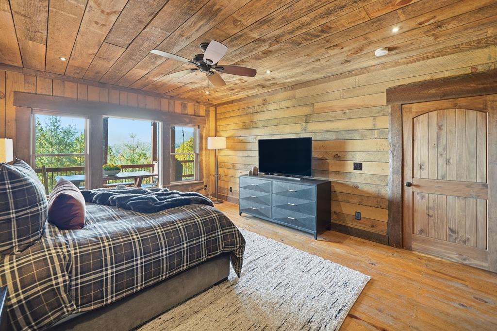 249 Settlement Road Epworth, GA 30541 - Photo 26 of 43 a bedroom with bed and a flat tv screen on dresser