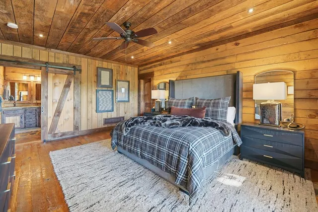 a spacious bathroom with a double vanity sink and a mirror