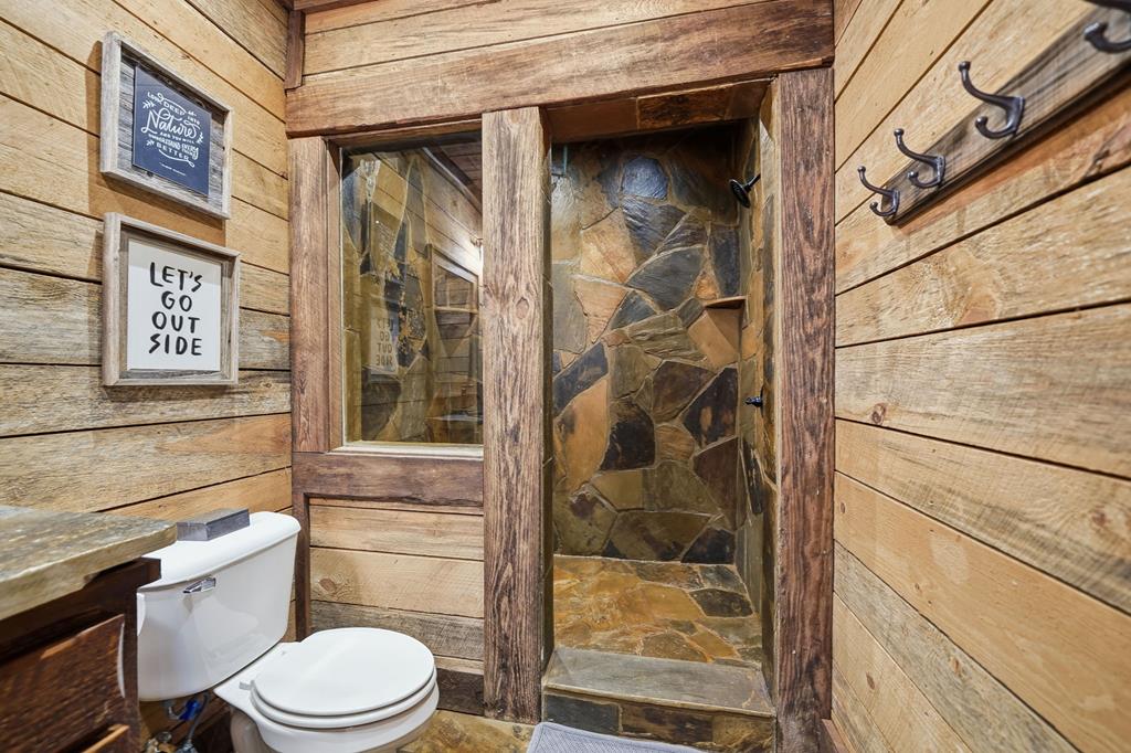 249 Settlement Road Epworth, GA 30541 - Photo 31 of 43 a bathroom with a toilet and a shower