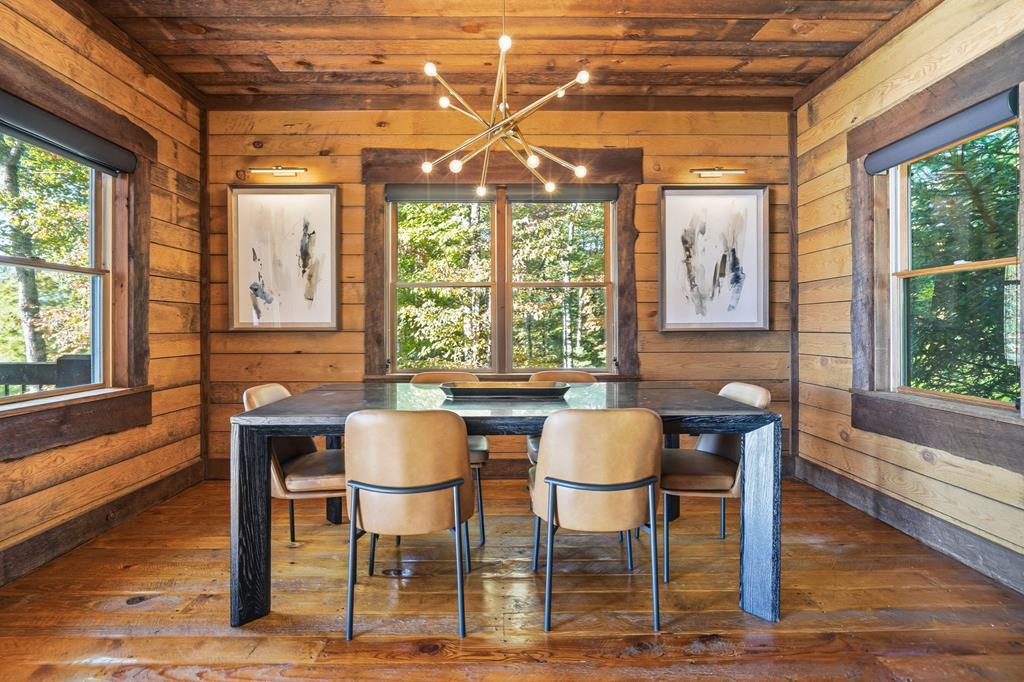 249 Settlement Road Epworth, GA 30541 - Photo 37 of 43 a dining room with wooden floor and window