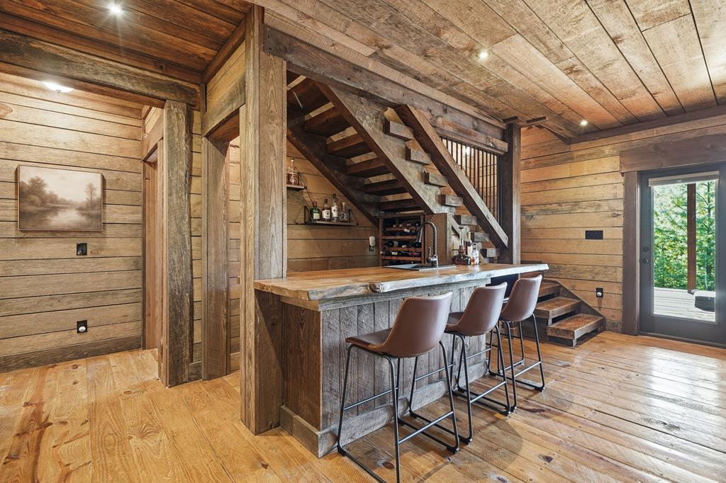 249 Settlement Road Epworth, GA 30541 - Photo 38 of 43 a dining room with furniture and wooden floor