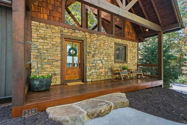 a building outdoor space with patio furniture and potted plants