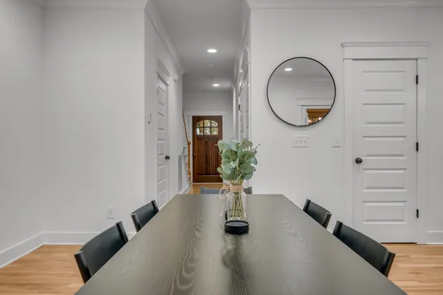 a living room with furniture and a mirror