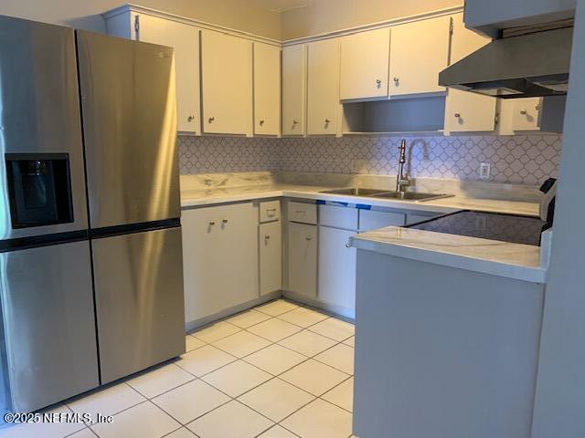 1122 West Pratt Street Starke, FL 32091 - Photo 2 of 7 a kitchen with stainless steel appliances a refrigerator sink and cabinets