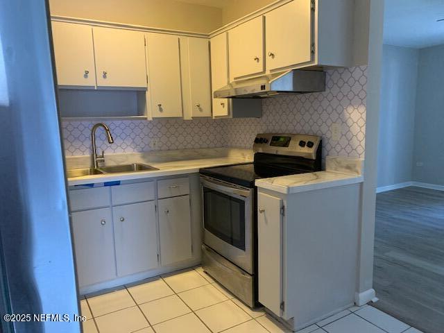 1122 West Pratt Street Starke, FL 32091 - Photo 3 of 7 a kitchen with stainless steel appliances a sink and a stove