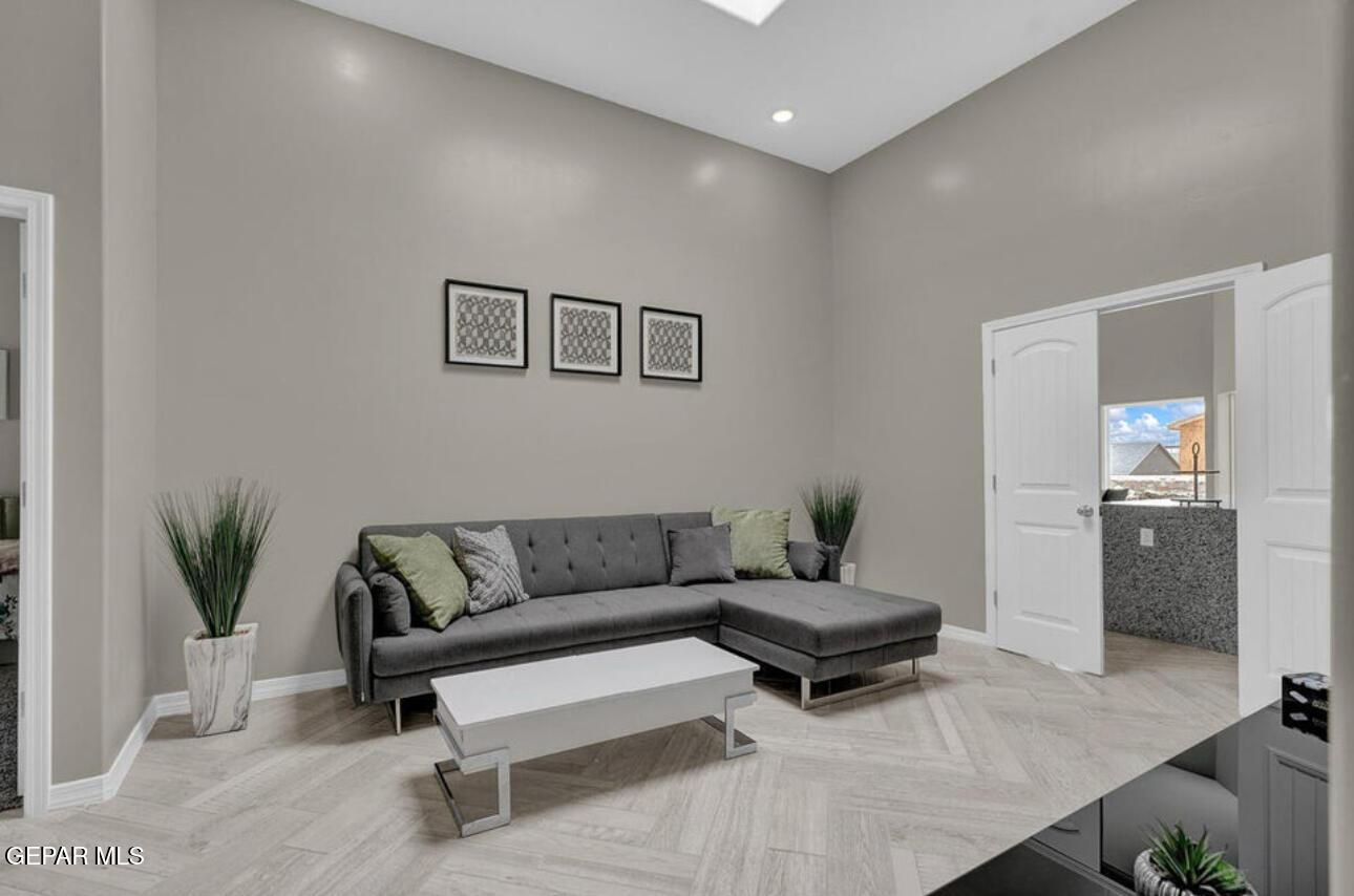 12422 Fill Ball Street El Paso, TX 79928 - Photo 23 of 32 a living room with furniture and a potted plant
