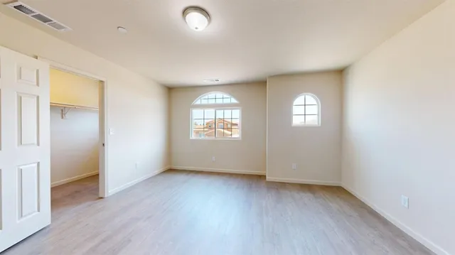 a bathroom with a double vanity sink mirror and bathtub