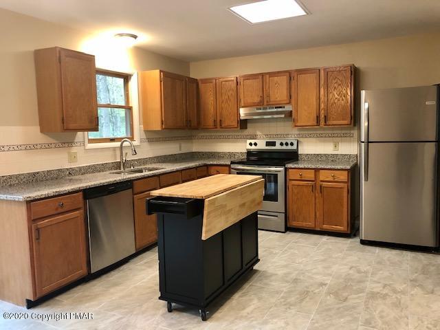 707 Dotters Corner Road Kunkletown, PA 18058 - Photo 3 of 18 a kitchen with stainless steel appliances granite countertop a stove a sink dishwasher a refrigerator and a oven