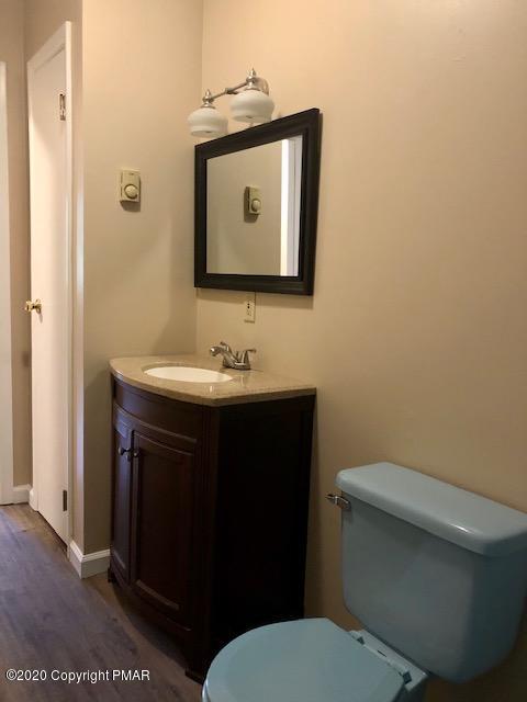 707 Dotters Corner Road Kunkletown, PA 18058 - Photo 10 of 18 a bathroom with a toilet sink and mirror