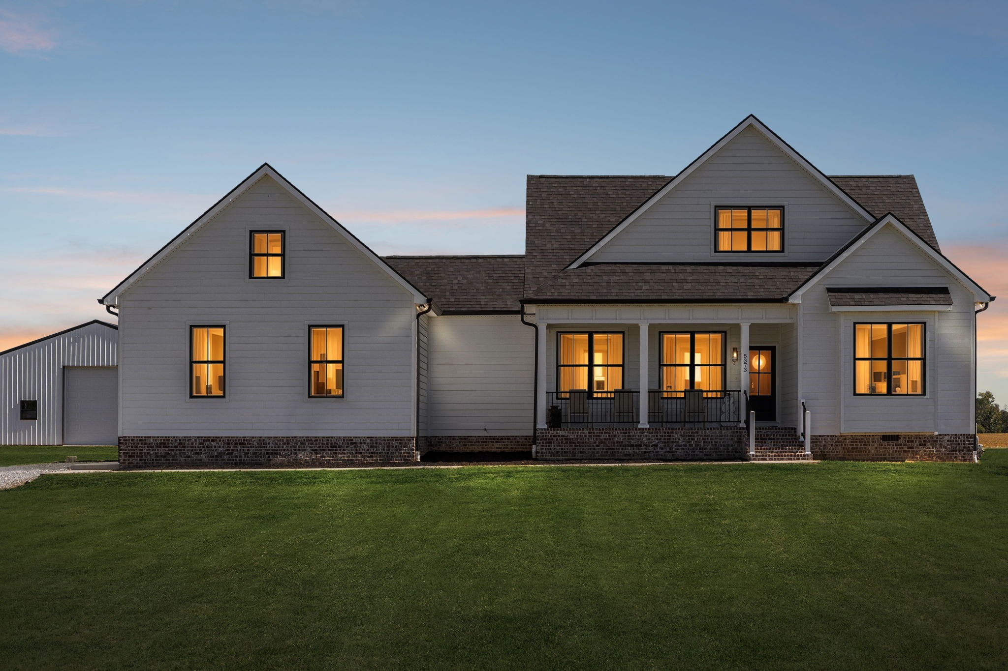 5373 East Robertson Road Orlinda, TN 37141 - Photo 2 of 57 a front view of a house with a yard and garage