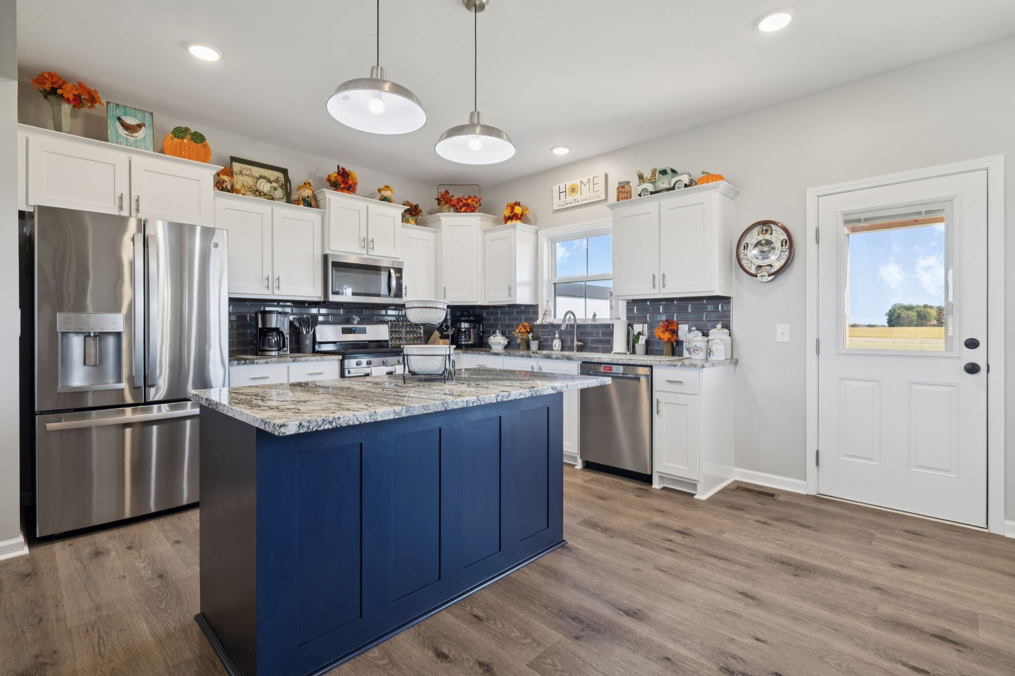 5373 East Robertson Road Orlinda, TN 37141 - Photo 30 of 57 a kitchen with stainless steel appliances granite countertop a refrigerator a stove a sink and a refrigerator