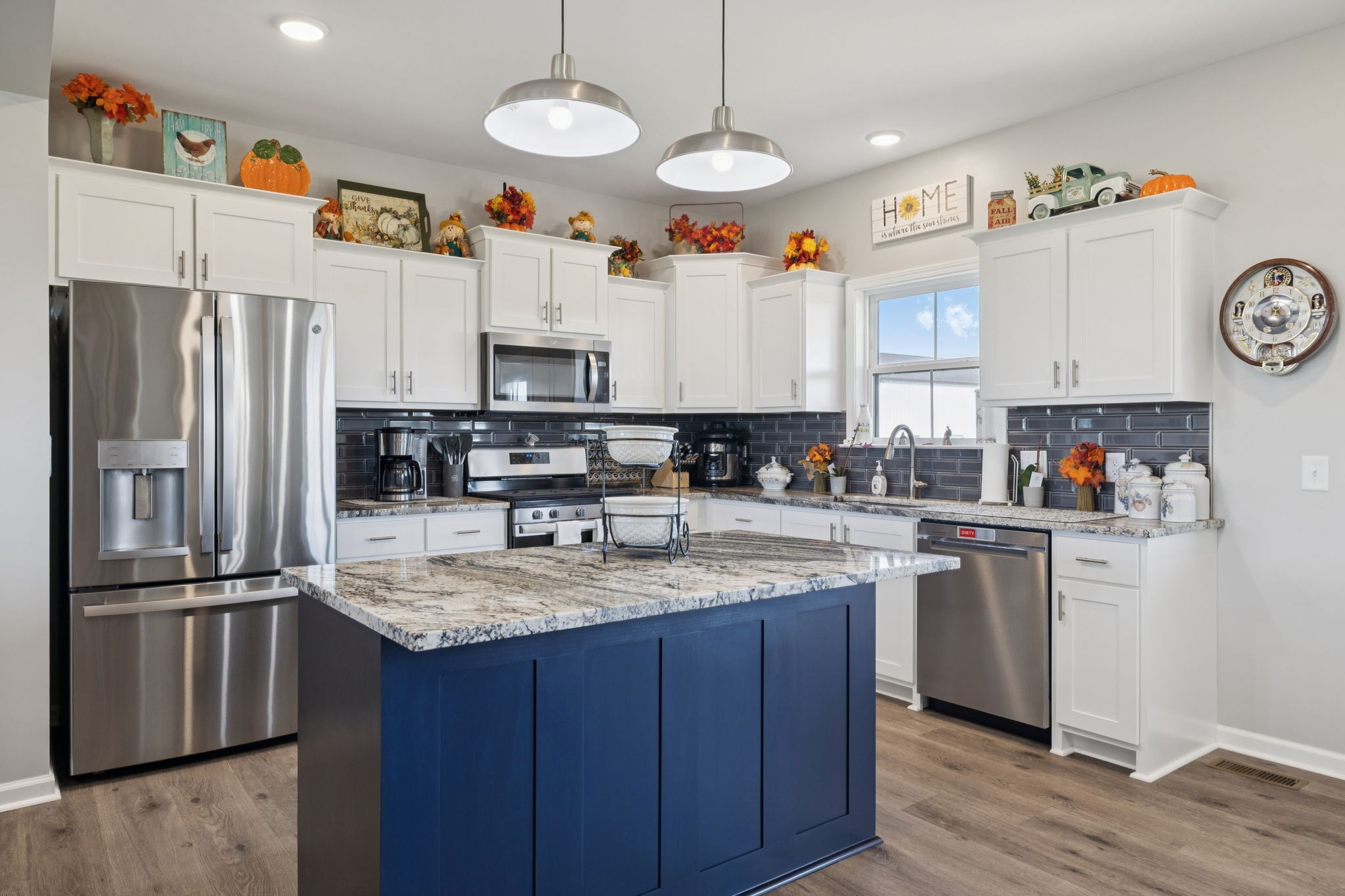 5373 East Robertson Road Orlinda, TN 37141 - Photo 31 of 57 a kitchen with stainless steel appliances granite countertop a refrigerator a stove and a sink