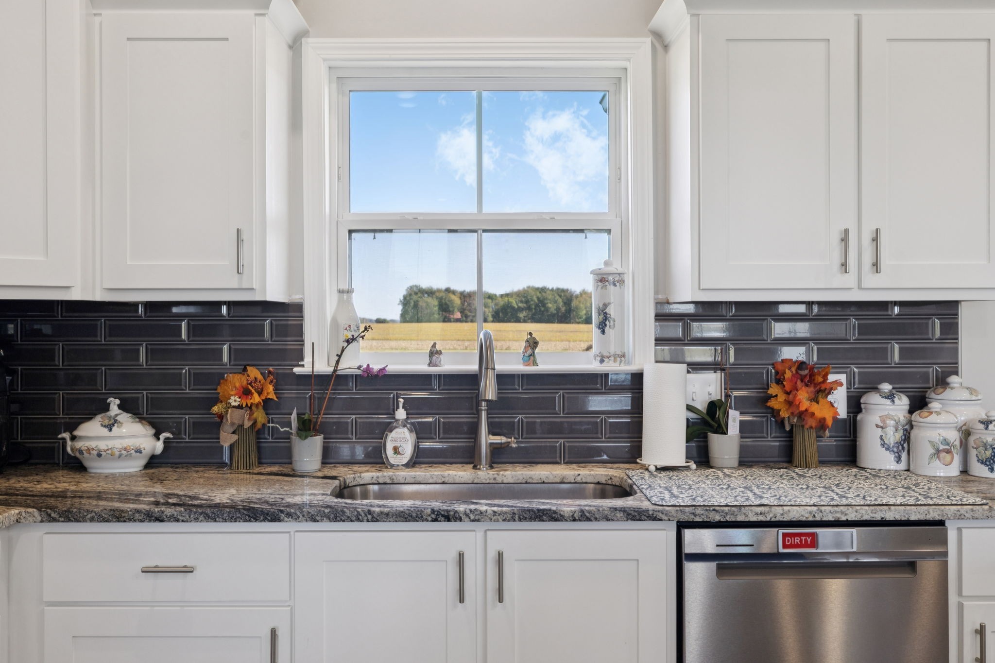 5373 East Robertson Road Orlinda, TN 37141 - Photo 34 of 57 a kitchen with granite countertop a sink stainless steel appliances and cabinets