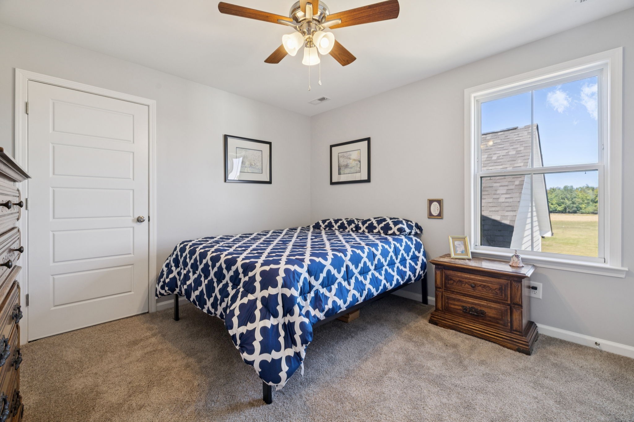 5373 East Robertson Road Orlinda, TN 37141 - Photo 41 of 57 a bedroom with a bed and a chandelier