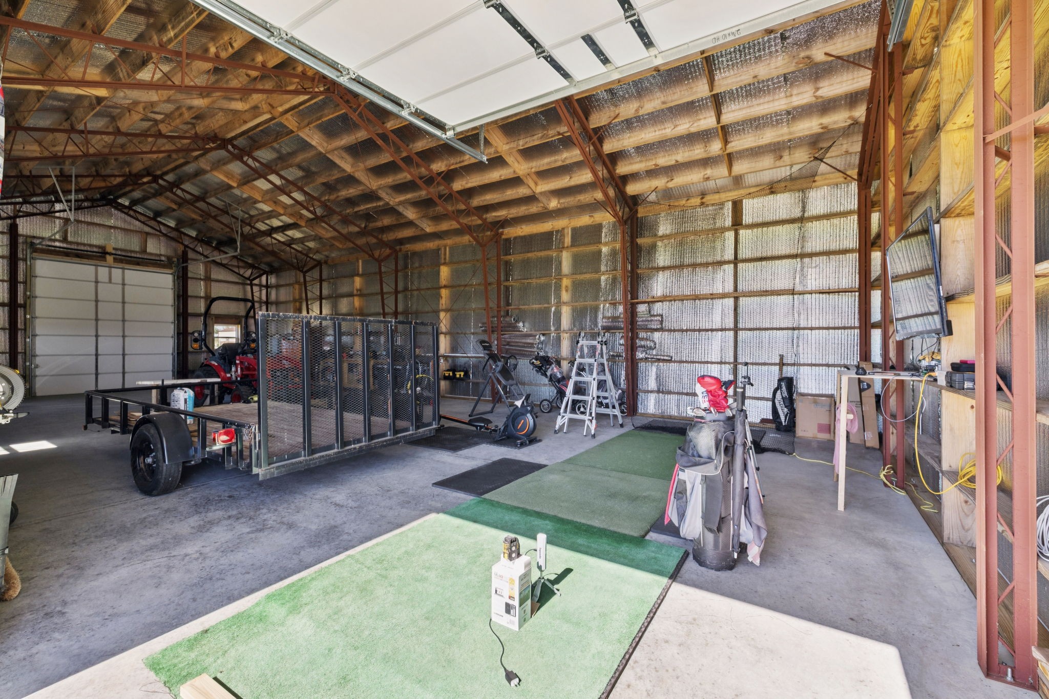 5373 East Robertson Road Orlinda, TN 37141 - Photo 48 of 57 a view of a garage with a bike and a car