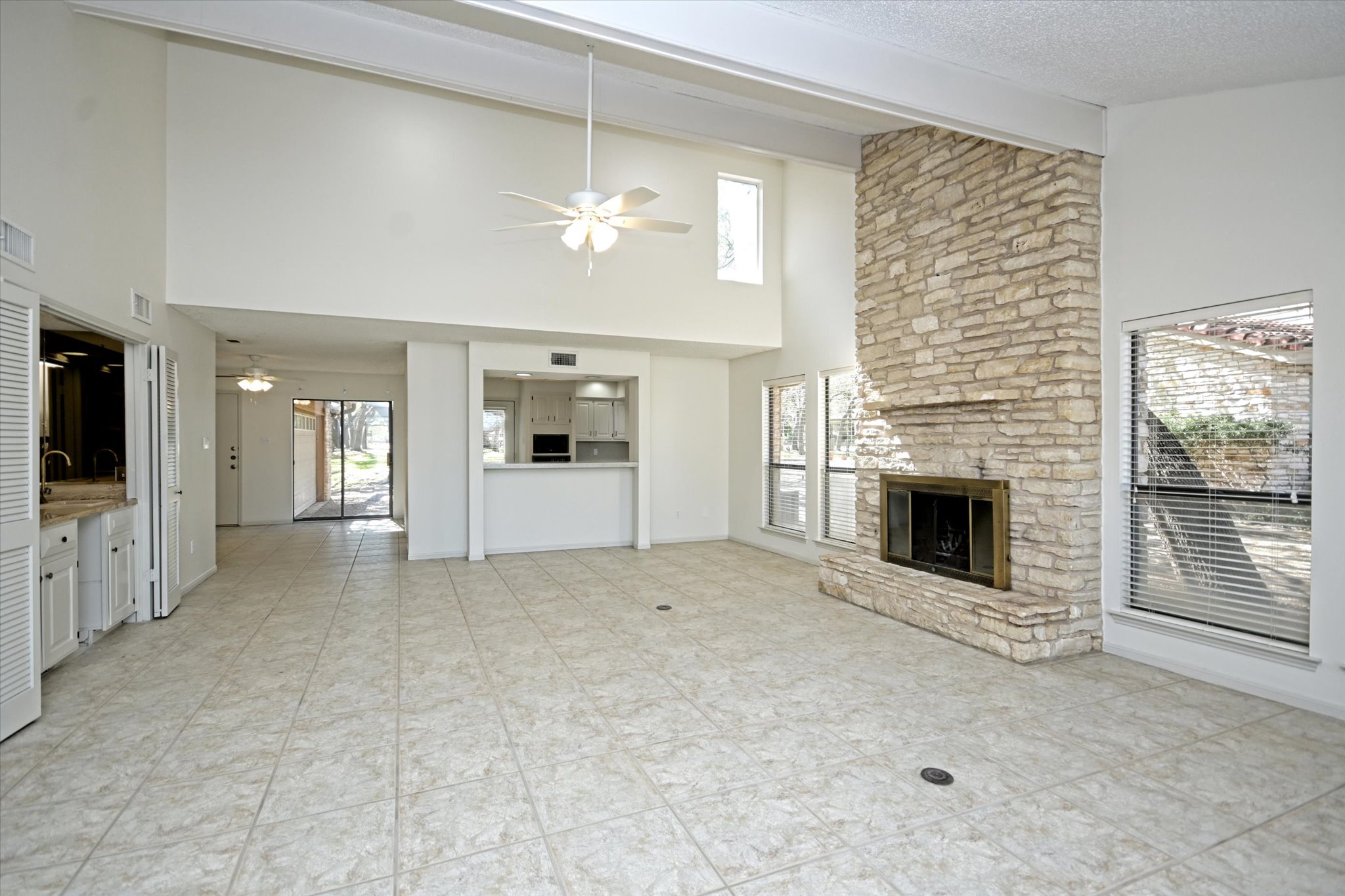 105 Crescent Bluff Austin, TX 78734 - Photo 6 of 28 a view of an empty room with a fireplace and a window