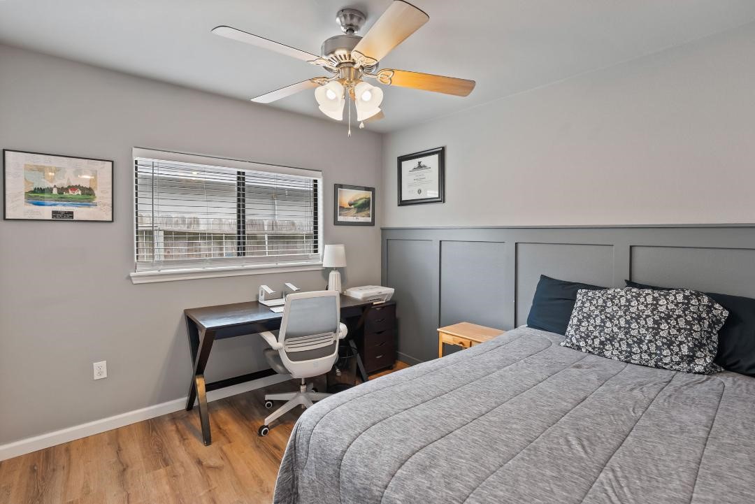 4328 Bratton Road Corpus Christi, TX 78413 - Photo 19 of 24 a bedroom with a bed and a chandelier