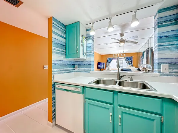 a living room with furniture a rug and a large window