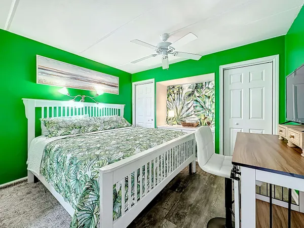 a view of empty room with a kitchen