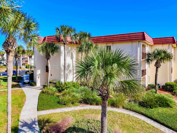 a view of a street with a building in the background