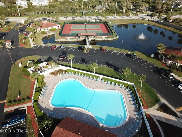 a view of a swimming pool with a yard