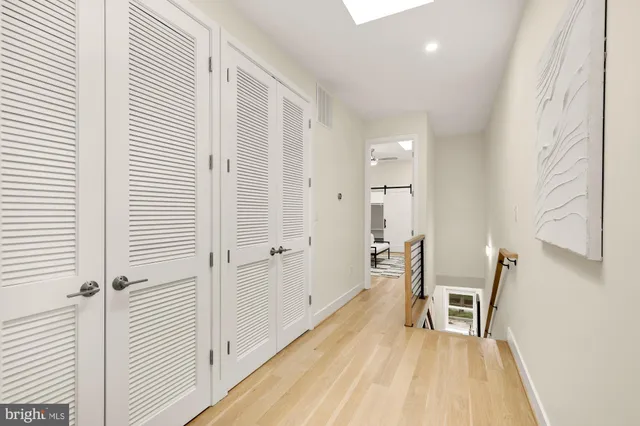 a view of kitchen with furniture and wooden floor