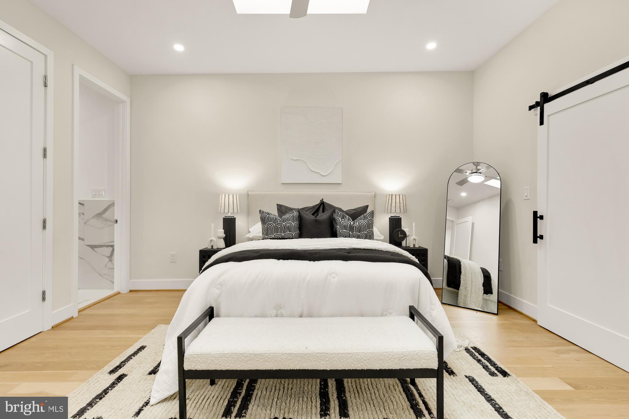 41 Q Street Northeast, Unit 2 Washington, DC 20002 - Photo 14 of 27 a bedroom with a bed and a chandelier