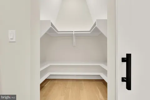 a bed room with a bed and a chair