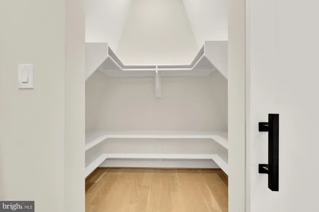 a bed room with a bed and a chair