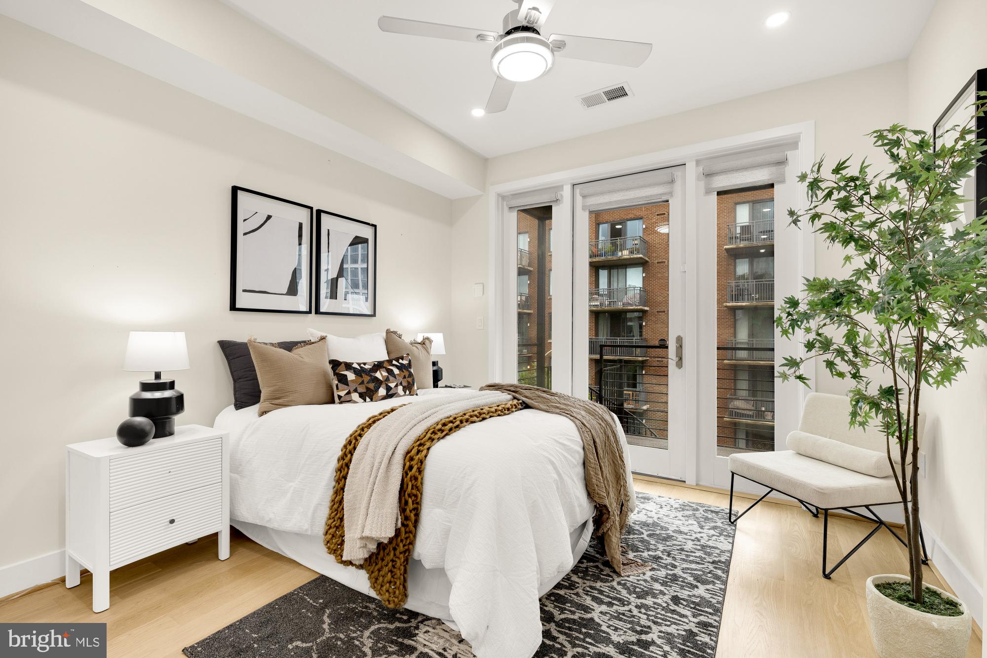 41 Q Street Northeast, Unit 2 Washington, DC 20002 - Photo 23 of 27 a bed room with a bed and a chair