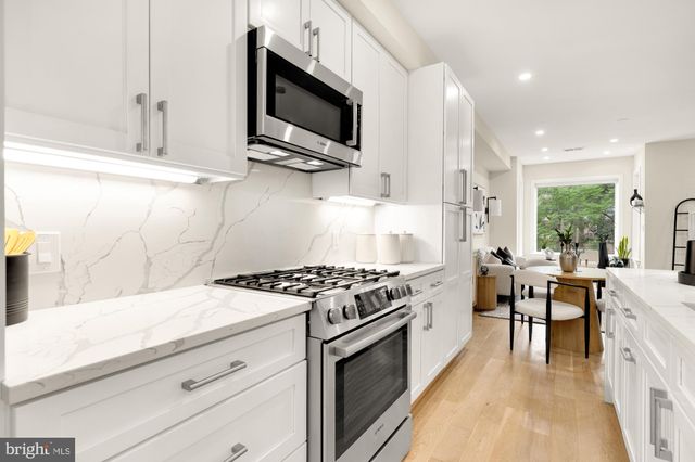 a kitchen with a stove and a microwave