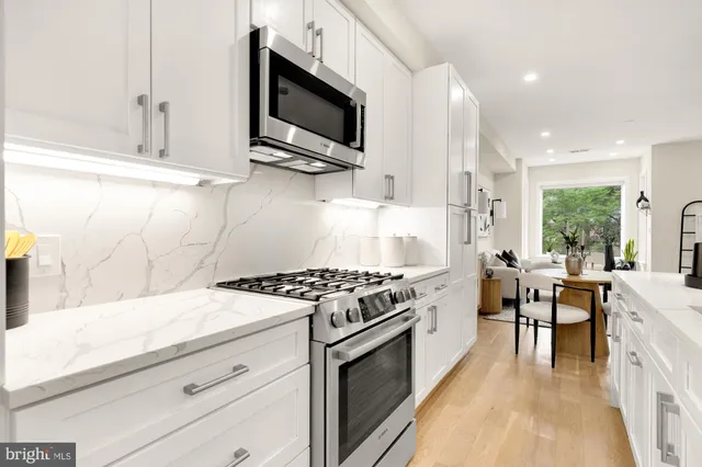 a kitchen with a stove and a microwave