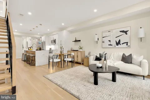 a living room with furniture and a table