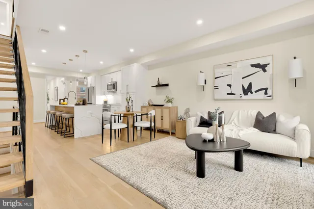 a living room with furniture and a table