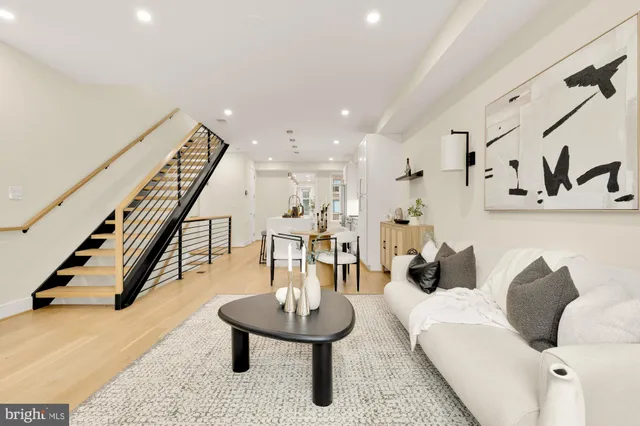 a living room with furniture and a table