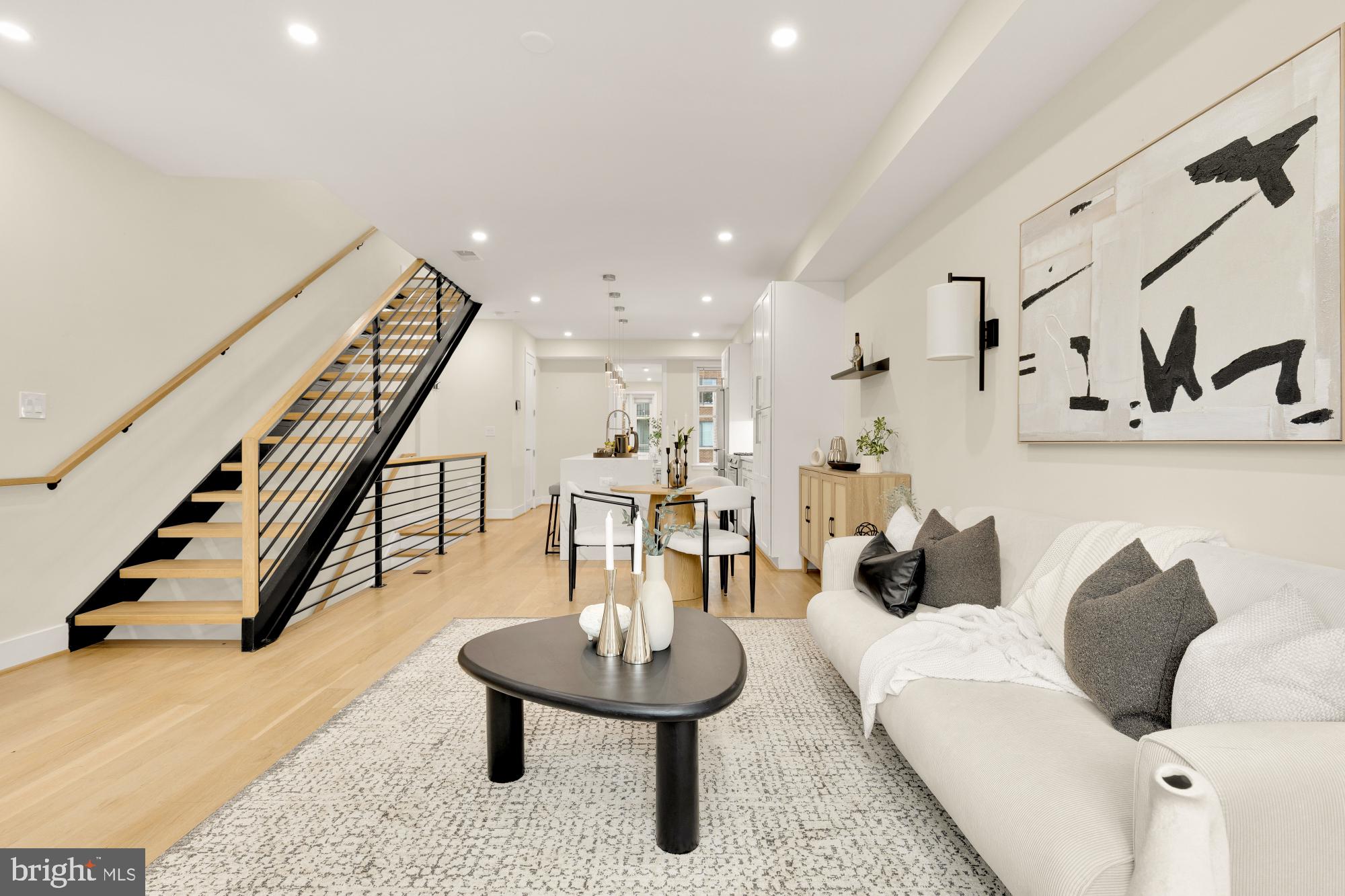 41 Q Street Northeast, Unit 2 Washington, DC 20002 - Photo 10 of 27 a living room with furniture and a table
