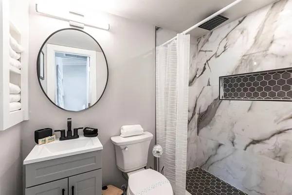 a bathroom with a toilet and a sink