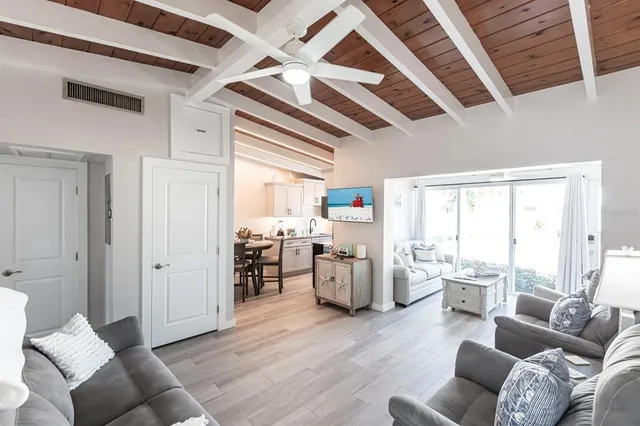 a living room with furniture window and wooden floor