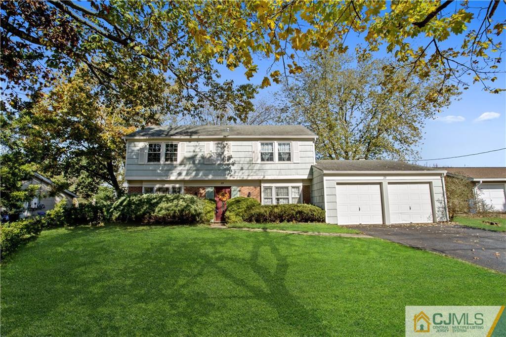 29 Abbott Road Somerset, NJ 08873 - Photo 1 of 10 a front view of a house with a garden and trees