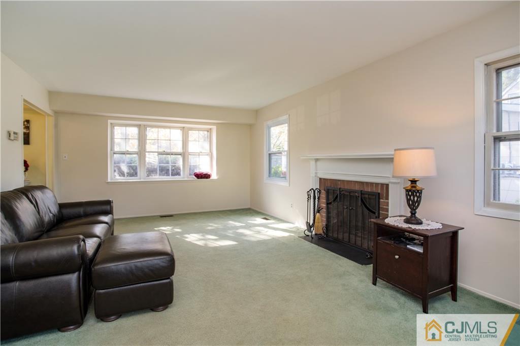 29 Abbott Road Somerset, NJ 08873 - Photo 6 of 10 a living room with furniture and a fireplace