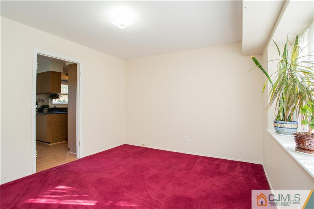 29 Abbott Road Somerset, NJ 08873 - Photo 7 of 10 a bedroom with a bed and a potted plant