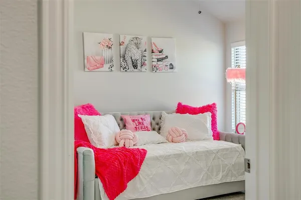 a living room with a couch and painting on the wall