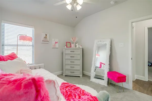 a bedroom with a bed and a couch