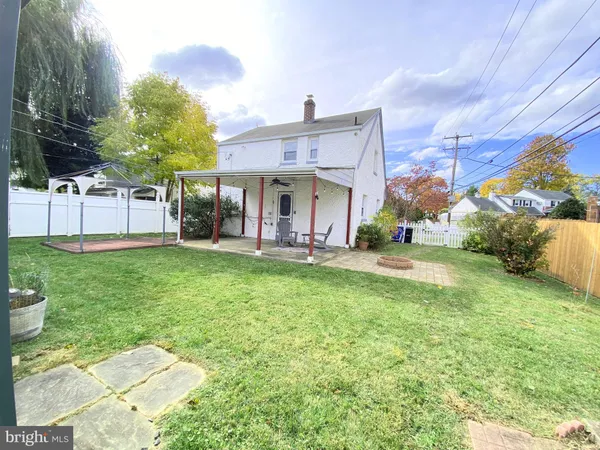 a view of a backyard of the house