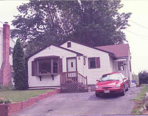 154 Hardy Pond Road Waltham, MA 02451 - Photo 1 of 1 a front view of a house with a garden