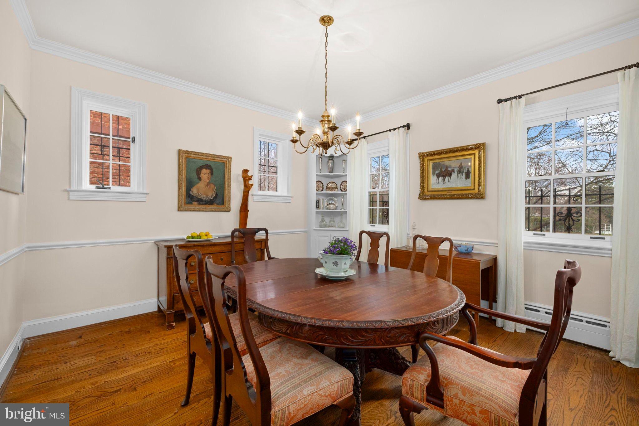 1554 34th Street Northwest Washington, DC 20007 - Photo 3 of 15 a view of a dining room with furniture and window