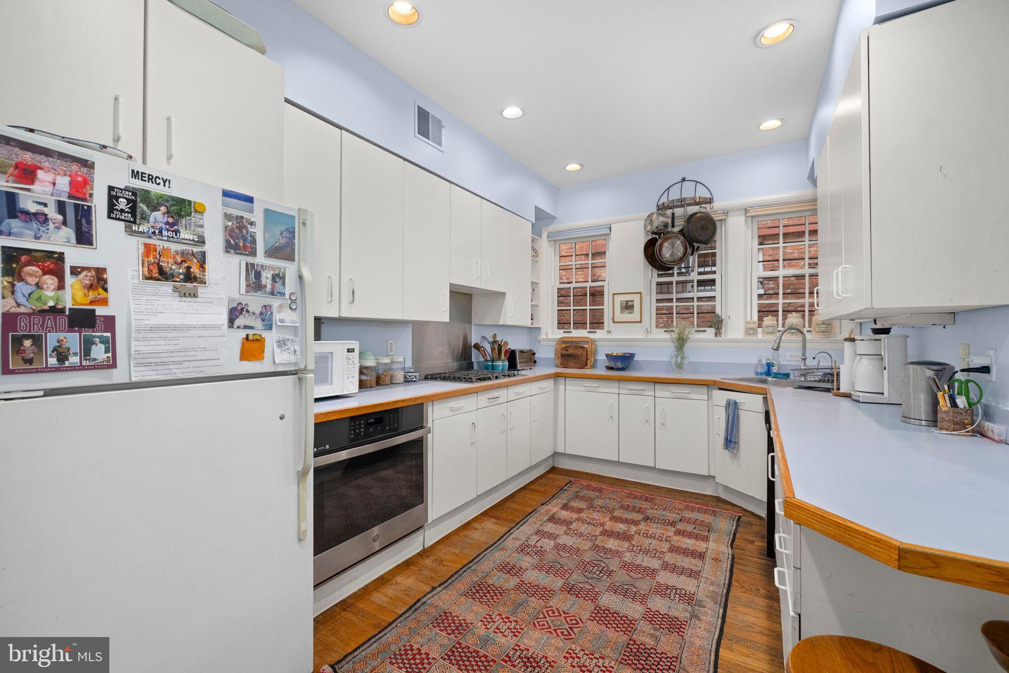 1554 34th Street Northwest Washington, DC 20007 - Photo 4 of 15 a kitchen with a refrigerator and a sink
