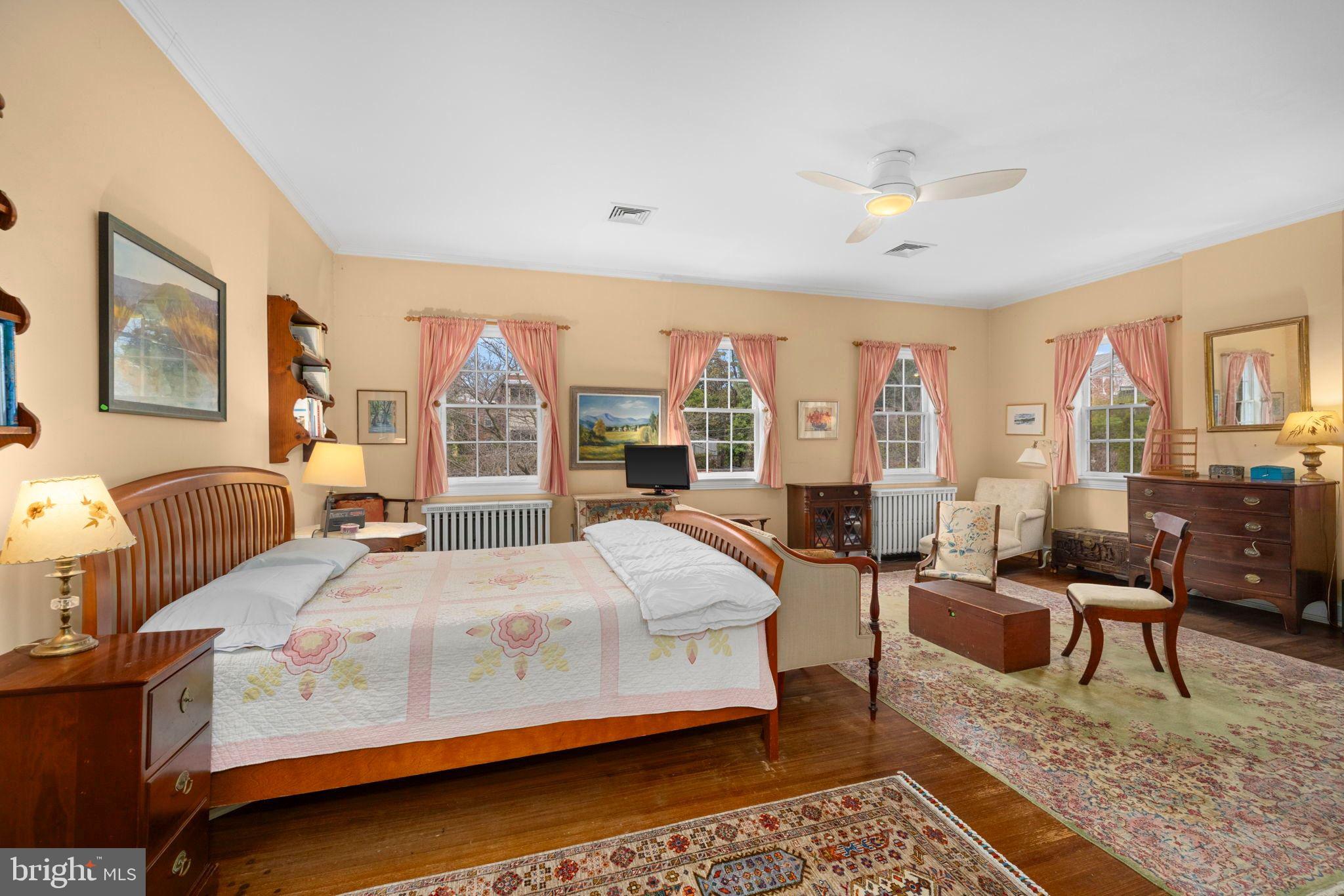 1554 34th Street Northwest Washington, DC 20007 - Photo 7 of 15 a bedroom with a bed couch and a large window